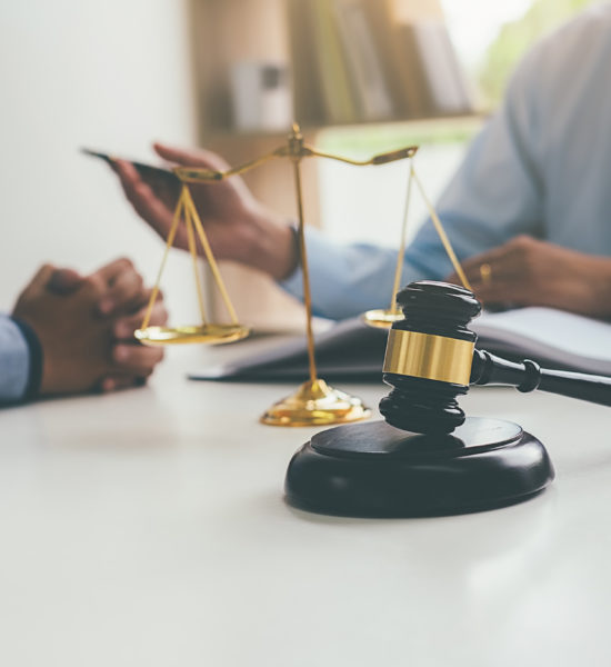Judge gavel with Justice lawyers having team meeting at law firm in background. Concepts of law. Judge gavel with Justice lawyers having team meeting at law firm in background. Concepts of law.